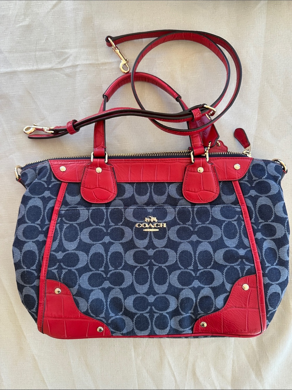 Denim coach with red leather trim